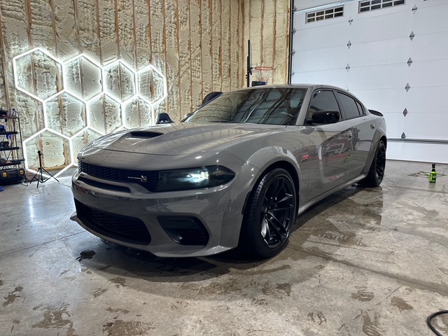 Gray performance car with tinted windows